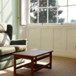 Pine room – Lounge area sofa by window