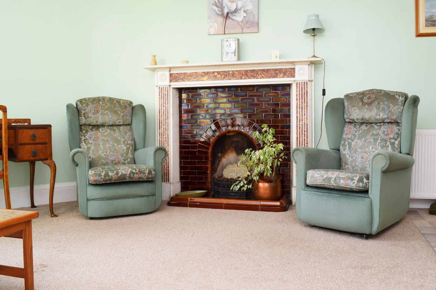 Pine Room - Fireplace and armchairs